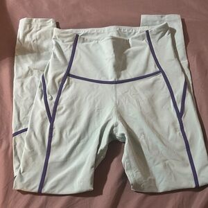 Light Teal Athletic Leggings with Purple Piping. Full length.